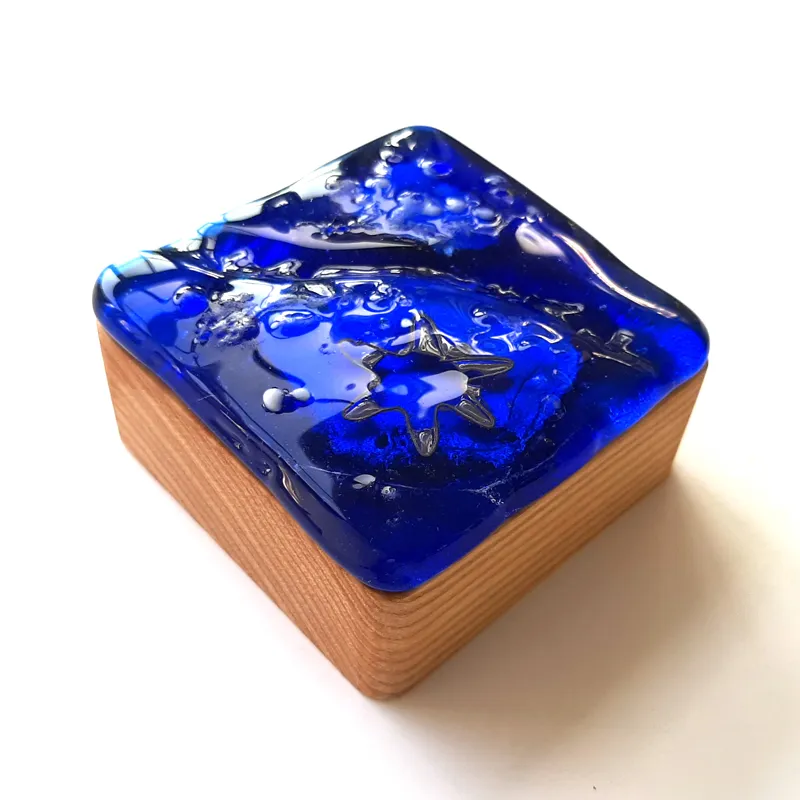 handmade glass treasure box in ocean blue tones, artisan glass box for calm, reflection, and mindfulness, blue glass jewelry box for meaningful small objects